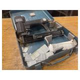 Campbell Hausfeld nail gun in metal storage case