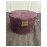 purple suede, oval-shaped jewelry case
