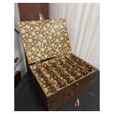 Vintage wooden sewing box featuring a "flower