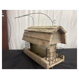 Rustic wooden hanging bird feeder with suet cages