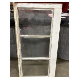 antique wooden sash window with three glass panes