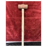 Garland rawhide mallet with a wooden handle.