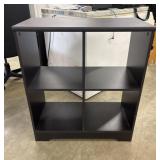 Black 4-cube storage bookcase similar to those