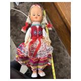 Vintage Polish folk art doll wearing a