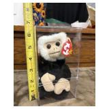 Ty Beanie Baby Mooch the Monkey plush toy in a