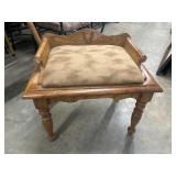 Vintage oak vanity bench featuring carved details