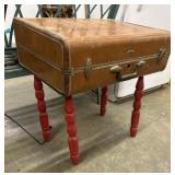 Vintage suitcase repurposed into a side table