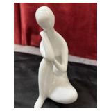 vintage white porcelain seated woman figurine