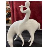 modernist white porcelain figurine of a person