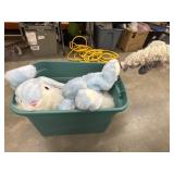 Tote of large stuffed animals.
