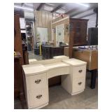 Vintage cream vanity and large mirror.
