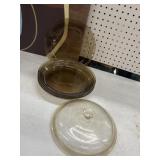 4 Pyrex Visions Amber glass pie plates and a lid