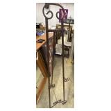 Black wrought iron display easel.