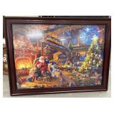 Framed 'Santa's Workshop' jigsaw puzzle.