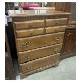 Light brown wooden chest of drawers