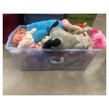 Large tote of stuffed animals and baby dolls.