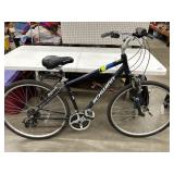 Blue Schwinn 21 Speed Fremont hybrid bike.