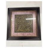 At Home medallion glass framed wall art features