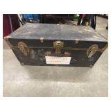This vintage Seward black steamer trunk is a
