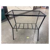 Black metal plant stand.
