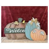 Fall themed pumpkin hangings.
