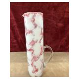 Hand -blown art glass pitcher.