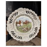 Vintage porcelain cabinet plate features a