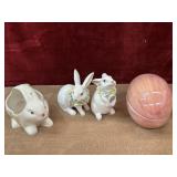Bundle of porcelain rabbits and egg.