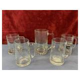 Bundle of glass beer mugs.