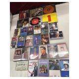 Bundle of cdï¿½s and cassette tapes.
