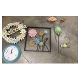 A 'Welcome' wreath and various metal floral wall