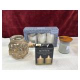Bundle of candles and bamboo wrapped vase.