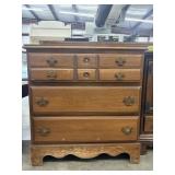 Vintage Colonial-style chest of drawers.