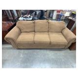 Tan Broyhill sofa features distinctive nailhead