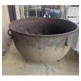Antique cast iron vessel is a vintage 3-legged