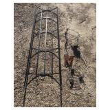 Curved metal garden trellis, plant stands,