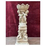 Neoclassical resin cherub pedestal planter.