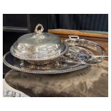 3 silver-plated covered serving dishes.