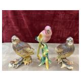 ceramic quails, and pink bird figurines.