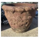 Classical-style, weathered terracotta garden pot.