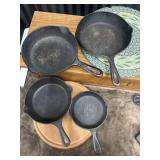 4 Cast iron skillets. One name brand Griswold.