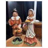 2 Vintage Thanksgiving pilgrim figurines.