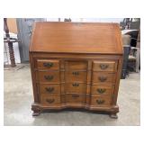 Vintage wooden drop-front secretary desk features