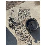 Ornate outdoor metal stuff. Wrought iron plant