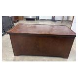 Vintage dark-stained wood storage trunk.