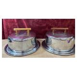 Stainless  steel domed serving dishes .
