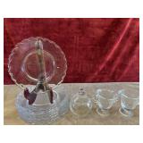 Clear pie plates, and sugar and creamer.