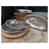 5 Silver plated serving trays.