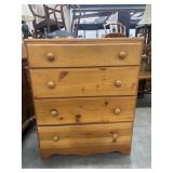 Honey-finish solid pine 4-drawer chest.
