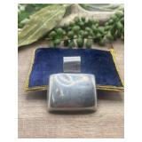 Vintage rectangular silver pendant with a curved